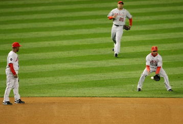 NEW YORK - OCTOBER 16:  Erick Aybar #2 of the Los Angeles Angels of Anaheim (R) lets a fly ball drop while Juan Rivera #20 (C) and Chone Figgins #9 (L) look on in the first inning of Game One of the ALCS during the 2009 MLB Playoffs at Yankee Stadium on October 16, 2009 in New York, New York.  (Photo by Nick Laham/Getty Images)
