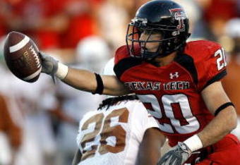 LUBBOCK, TX-OCTOBER 28: Danny Amendola #20 of the Texas Tech Red Raiders signals for a first down after catching a pass against Tarell Brown #5 of the Texas Longhorns at Jones AT&T Stadium on October 28, 2006 in Lubbock, Texas. (Photo by Layne Murdoch/Getty Images)