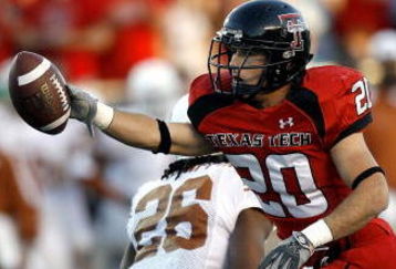 LUBBOCK, TX-OCTOBER 28: Danny Amendola #20 of the Texas Tech Red Raiders signals for a first down after catching a pass against Tarell Brown #5 of the Texas Longhorns at Jones AT&T Stadium on October 28, 2006 in Lubbock, Texas. (Photo by Layne Murdoch/Getty Images)