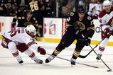 BOSTON - MARCH 05:  Milan Lucic #17 of the Boston Bruins tries to get around Matthew Lombardi #15 of the Phoenix Coyotes on March 5, 2009 at the TD Banknorth Garden in Boston, Massachusetts. The Coyotes defeated the Bruins 2-1.  (Photo by Elsa/Getty Images)