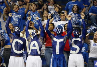 LEXINGTON, KENTUCKY - DECEMBER 27:  Fans of the Kentucky Wildcats show their support for their team during the game against the Louisville Cardinals on December 27, 2003 at Rupp Arena in Lexington, Kentucky. The Cardinals defeated the Wildcats 65-56. (Photo by Andy Lyons/Getty Images)