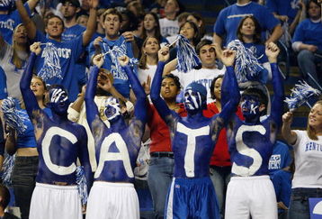 LEXINGTON, KENTUCKY - DECEMBER 27:  Fans of the Kentucky Wildcats show their support for their team during the game against the Louisville Cardinals on December 27, 2003 at Rupp Arena in Lexington, Kentucky. The Cardinals defeated the Wildcats 65-56. (Photo by Andy Lyons/Getty Images)