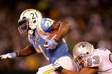 OAKLAND, CA - SEPTEMBER 14:  LaDainian Tomlinson #21 of the San Diego Chargers is tackled by Tyvon Branch #33 of the Oakland Raiders during their game on September 14, 2009 at the Oakland-Alameda County Coliseum in Oakland, California.  (Photo by Ezra Shaw/Getty Images)