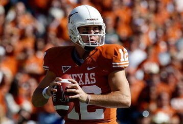 DALLAS - OCTOBER 17:  Quarterback Colt McCoy #12 of the Texas Longhorns drops back to pass against the Oklahoma Sooners at Cotton Bowl on October 17, 2009 in Dallas, Texas.  (Photo by Ronald Martinez/Getty Images)