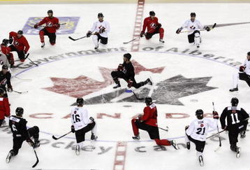 CALGARY, CANADA - AUGUST 24: Scott Niedermayer (centre) leads the stretching during the second practice of theTeam Canada Olympic Orientation Camp on August 24, 2009 at the Pengrowth Saddledome in Calgary, Alberta, Canada. (Photo by Mike Ridewood/Getty Images)