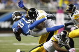 DETROIT , MI - OCTOBER 11: Calvin Johnson #81 of the Detroit Lions is tackled by James Harrison #92 of the Pittsburgh Steelers October 11, 2009 at Ford Field in Detroit, Michigan. Johnson was injured on the play. (Photo by Gregory Shamus/Getty Images)