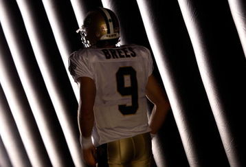 NEW ORLEANS - OCTOBER 04:  Quarterback Drew Brees #9 of the New Orleans Saints waits to be introduced before the game against the New York Jets at the Louisana Superdome on October 4, 2009 in New Orleans, Louisiana.  (Photo by Chris Graythen/Getty Images)