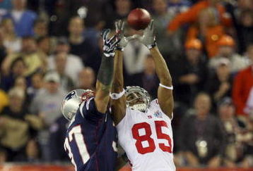 GLENDALE, AZ - FEBRUARY 03:  David Tyree #85 of the New York Giants catches a 32-yard pass from Eli Manning #10 as Rodney Harrison #37 of the New England Patriots attempts to knock it out in the fourth quarter of Super Bowl XLII on February 3, 2008 at the University of Phoenix Stadium in Glendale, Arizona.  (Photo by Donald Miralle/Getty Images)