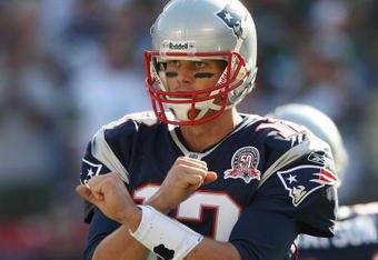 EAST RUTHERFORD, NJ - SEPTEMBER 20:  Tom Brady #12 of the New England Patriots gestures against the New York Jets at Giants Stadium on September 20, 2009 in East Rutherford, New Jersey.  (Photo by Nick Laham/Getty Images)