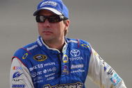 FONTANA, CA - OCTOBER 09: David Reutimann, driver of the #00 Aaron's Dream Machine Toyota sits on pit wall during qualifying for the NASCAR Sprint Cup Series Pepsi 500 at Auto Club Speedway on October 9, 2009 in Fontana, California. (Photo by Jason Smith/Getty Images)