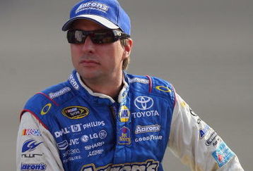 FONTANA, CA - OCTOBER 09:  David Reutimann, driver of the #00 Aaron's Dream Machine Toyota sits on pit wall during qualifying for the NASCAR Sprint Cup Series Pepsi 500 at Auto Club Speedway on October 9, 2009 in Fontana, California.  (Photo by Jason Smith/Getty Images)