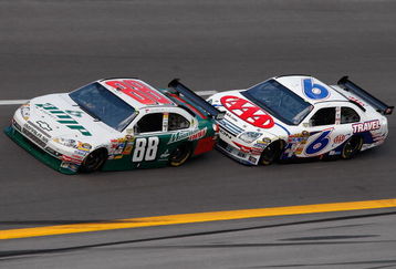 TALLADEGA, AL - OCTOBER 05:  Dale Earnhardt Jr., driver of the AMP Energy/National Guard Chevrolet, and David Ragan, driver of the #6 AAA Travel Ford, drive during the NASCAR Sprint Cup Series Amp Energy 500 at Talladega Superspeedway on October 5, 2008 in Talladega, AL.  (Photo by John Harrelson/Getty Images for NASCAR)