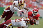 KANSAS CITY, MO - OCTOBER 16:   Dante Hall #82 of the Kansas City Chiefs makes a catch against Sean Taylor #21 and Marcus Washington #53 of the Washington Redskins in the first half on October 16, 2005 at Arrowhead Stadium in Kansas City, Missouri.  (Photo by Larry W. Smith/Getty Images)