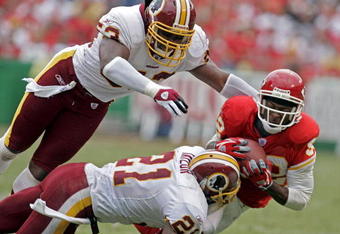 KANSAS CITY, MO - OCTOBER 16:   Dante Hall #82 of the Kansas City Chiefs makes a catch against Sean Taylor #21 and Marcus Washington #53 of the Washington Redskins in the first half on October 16, 2005 at Arrowhead Stadium in Kansas City, Missouri.  (Photo by Larry W. Smith/Getty Images)