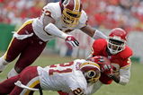 KANSAS CITY, MO - OCTOBER 16:   Dante Hall #82 of the Kansas City Chiefs makes a catch against Sean Taylor #21 and Marcus Washington #53 of the Washington Redskins in the first half on October 16, 2005 at Arrowhead Stadium in Kansas City, Missouri.  (Photo by Larry W. Smith/Getty Images)