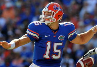 GAINESVILLE, FL - OCTOBER 17: Quarterback Tim Tebow #15 of the Florida Gators fumbles before passing in the first quarter against the University of Arkansas Razorbacks October 17, 2009 at Ben Hill Griffin Stadium in Gainesville, Florida.  (Photo by Al Messerschmidt/Getty Images)