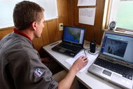 LA JOLLA, CA - FEBRUARY 06:  PGA TOUR Onsite Meteorologist Wade Stettner works on his computer following weather on the dopler radar during the 2nd Round of the Buick Invitational at the Torrey Pines North Course on February 6, 2009 in La Jolla, California. (Photo by Donald Miralle/Getty Images)