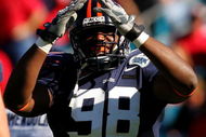 JACKSONVILLE, FL - JANUARY 01: Nate Collins #98 of the Virginia Cavaliers celebrates a safety during the Gator Bowl against the Texas Tech Red Raiders at Jacksonville Municipal Stadium on January 1, 2008 in Jacksonville, Florida. (Photo by Sam Greenwood/Getty Images)