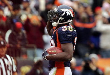 DENVER - OCTOBER 30:  Running back Mike Anderson #38 of the Denver Broncos gives a 'Mile High Salute' after scoring a touchdown against the Philadelphia Eagles in the first quarter on October 30, 2005 at Invesco Field at Mile High in Denver, Colorado.  The Broncos won 49-21.  (Photo by Brian Bahr/Getty Images)