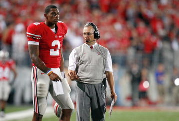 COLUMBUS, OH - SEPTEMBER 12: Quarterback Terrelle Pryor #2 of the Ohio State Buckeyes and head coach Jim Tressel walk on the field during the game against the Southern California Trojans on September 12, 2009 at Ohio Stadium in Columbus, Ohio. The Trojans defeated the Buckeyes 18-15. (Photo by Gregory Shamus/Getty Images)