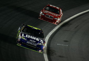 CONCORD, NC - OCTOBER 17:  Jimmie Johnson, driver of the #48 Lowe's Chevrolet, races Kasey Kahne, driver of the #9 Budweiser Dodge, during the NASCAR Sprint Cup Series NASCAR Banking 500 at Lowe's Motor Speedway on October 17, 2009 in Concord, North Carolina.  (Photo by Jason Smith/Getty Images for NASCAR)