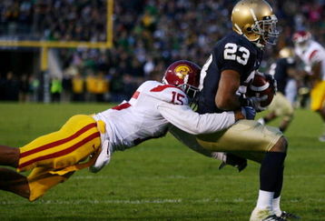 SOUTH BEND, IN - OCTOBER 17: Wide receiver Golden Tate #23 of the Notre Dame Fighting Irish makes a catch for a touchdown against Kevin Thomas #15 of the USC Trojans at Notre Dame Stadium on October 17, 2009 in South Bend, Indiana. USC won the game 34-27. (Photo by Jonathan Daniel/Getty Images)