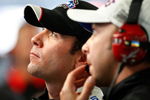 CONCORD, NC - OCTOBER 16: Jimmie Johnson (L), driver of the #48 Lowe's Chevrolet, watches lap times with crew chief Chad Knaus (R) during practice for the NASCAR Sprint Cup Series NASCAR Banking 500 at Lowe's Motor Speedway on October 16, 2009 in Concord, North Carolina.  (Photo by Geoff Burke/Getty Images for NASCAR)