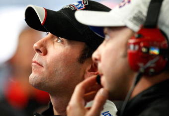 CONCORD, NC - OCTOBER 16: Jimmie Johnson (L), driver of the #48 Lowe's Chevrolet, watches lap times with crew chief Chad Knaus (R) during practice for the NASCAR Sprint Cup Series NASCAR Banking 500 at Lowe's Motor Speedway on October 16, 2009 in Concord, North Carolina.  (Photo by Geoff Burke/Getty Images for NASCAR)