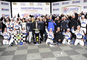 CONCORD, NC - OCTOBER 17:  Jimmie Johnson, driver of the #48 Lowe's Chevrolet, celebrates with his team after winning the NASCAR Sprint Cup Series NASCAR Banking 500 at Lowe's Motor Speedway on October 17, 2009 in Concord, North Carolina.  (Photo by John Harrelson/Getty Images for NASCAR)