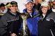 CONCORD, NC - OCTOBER 17:  (L-R) Jimmie Johnson, driver of the #48 Lowe's Chevrolet, celebrates with his crew chief Chad Knaus and team owner Rick Hendrick after winning the NASCAR Sprint Cup Series NASCAR Banking 500 at Lowe's Motor Speedway on October 17, 2009 in Concord, North Carolina.  (Photo by Rusty Jarrett/Getty Images for NASCAR)