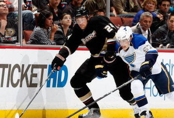 ANAHEIM, CA - OCTOBER 17:  Evgeny Artyukhin #24 of the Anaheim Ducks and David Perron #57 of the St. Louis Blues battle for the puck in the third period at Honda Center on October 17, 2009 in Anaheim, California. The Blues defeated the Ducks 5-0.  (Photo by Jeff Gross/Getty Images)