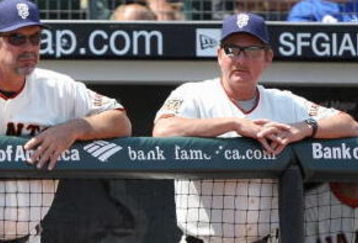 SAN FRANCISCO - JULY 6: Manager Bruce Bochy #15 and coach Carney Lansford #9 of the San Francisco Giants watch the action against  the Los Angeles Dodgers during a Major League Baseball game on July 6, 2008 at AT&T Park in San Francisco, California. (Photo by: Jed Jacobsohn/Getty Images)