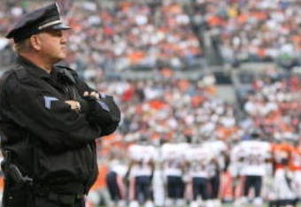 DENVER - AUGUST 30:  A police officer stands on the field during a break from the preseason game between the Chicago Bears and the Denver Broncos at INVESCO Field at Mile High on August 30, 2009 in Denver, Colorado.  (Photo by Doug Pensinger/Getty Images)