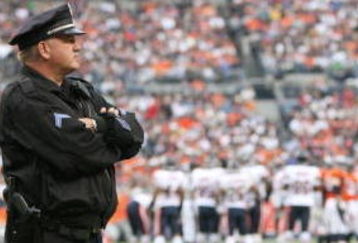 DENVER - AUGUST 30:  A police officer stands on the field during a break from the preseason game between the Chicago Bears and the Denver Broncos at INVESCO Field at Mile High on August 30, 2009 in Denver, Colorado.  (Photo by Doug Pensinger/Getty Images)