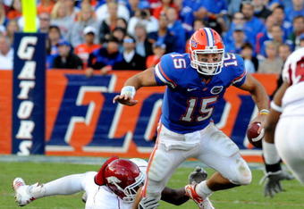 GAINESVILLE, FL - OCTOBER 17: Quarterback Tim Tebow #15 of the Florida Gators rushes upfield against the University of Arkansas Razorbacks October 17, 2009 at Ben Hill Griffin Stadium in Gainesville, Florida.  (Photo by Al Messerschmidt/Getty Images)