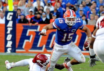 GAINESVILLE, FL - OCTOBER 17: Quarterback Tim Tebow #15 of the Florida Gators rushes upfield against the University of Arkansas Razorbacks October 17, 2009 at Ben Hill Griffin Stadium in Gainesville, Florida.  (Photo by Al Messerschmidt/Getty Images)