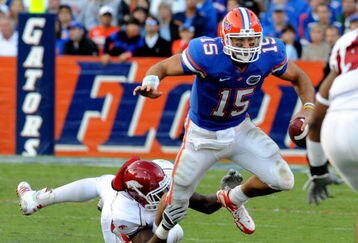GAINESVILLE, FL - OCTOBER 17: Quarterback Tim Tebow #15 of the Florida Gators rushes upfield against the University of Arkansas Razorbacks October 17, 2009 at Ben Hill Griffin Stadium in Gainesville, Florida.  (Photo by Al Messerschmidt/Getty Images)
