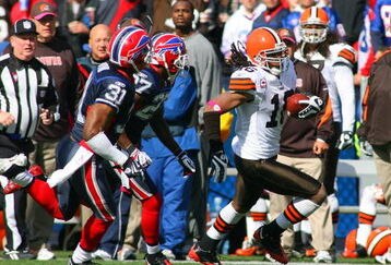 ORCHARD PARK, NY - OCTOBER 11: Joshua Cribbs #16 of the Cleveland Browns runs ahead of Reggie Corner #27 and Jairus Byrd #31 of the Buffalo Bills against at Ralph Wilson Stadium on October 11, 2009 in Orchard Park, New York. The Browns defeated the Bills 6-3. (Photo by Rick Stewart/Getty Images)