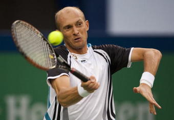 SHANGHAI, CHINA - OCTOBER 17:  Nikolay Davydenko of Russia returns a shot to Novak Djokovic of Serbia on their semi final match during day seven of 2009 Shanghai ATP Masters 1000 at Qi Zhong Tennis Centre on October 17, 2009  (Photo by Victor Fraile/Getty Images)