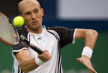 SHANGHAI, CHINA - OCTOBER 17:  Nikolay Davydenko of Russia returns a shot to Novak Djokovic of Serbia on their semi final match during day seven of 2009 Shanghai ATP Masters 1000 at Qi Zhong Tennis Centre on October 17, 2009  (Photo by Victor Fraile/Getty Images)
