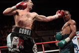 NOTTINGHAM, ENGLAND - OCTOBER 17:  Carl Froch (L) connects with a left hook as he retains his title against Andre Dirrell during their WBC Super Middleweight fight on October 17, 2009 at Trent FM Arena in Nottingham, England.  (Photo by John Gichigi/Getty Images)