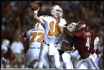14 OCT 1995:  TENNESSEE QUARTERBACK PEYTON MANNING THROWS THE FOOTBALL AS PRESSURE IS APPLIED DURING THE VOLUNTEERS 41-14 VICTORY OVER THE ALABAMA CRIMSON TIDE AT LEGION FIELD IN BIRMINGHAM, ALABAMA.  Mandatory Credit:  Al Bello/Allsport