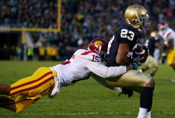 SOUTH BEND, IN - OCTOBER 17: Wide receiver Golden Tate #23 of the Notre Dame Fighting Irish makes a catch for a touchdown against Kevin Thomas #15 of the USC Trojans at Notre Dame Stadium on October 17, 2009 in South Bend, Indiana. USC won the game 34-27. (Photo by Jonathan Daniel/Getty Images)