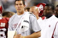 ARLINGTON, TX - SEPTEMBER 05: Quarterback Sam Bradford #14 of the Oklahoma Sooners stands on the sidelines after suffering an injury against the Brigham Young Cougars at Cowboys Stadium on September 5, 2009 in Arlington, Texas. (Photo by Ronald Martinez/Getty Images)