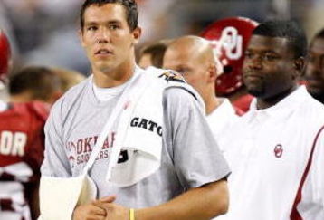 ARLINGTON, TX - SEPTEMBER 05:  Quarterback Sam Bradford #14 of the Oklahoma Sooners stands on the sidelines after suffering an injury against the Brigham Young Cougars at Cowboys Stadium on September 5, 2009 in Arlington, Texas.  (Photo by Ronald Martinez/Getty Images)