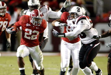 TUSCALOOSA - OCTOBER 17:  Running back Mark Ingram #22 of the Alabama Crimson Tide breaks through the line of scrimmage on a running play during the game against the South Carolina Gamecocks at Bryant-Denny Stadium on October 17, 2009 in Tuscaloosa, Alabama.  The Crimson Tide beat the Gamecocks 20-6.  (Photo by Mike Zarrilli/Getty Images)