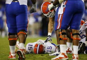 LEXINGTON, KY - SEPTEMBER 26: Quarterback Tim Tebow #15 of the Florida Gators lays on the ground after being sacked by Taylor Wyndham #94 of the Kentucky Wildcats during the third quarter of the game at Commonwealth Stadium on September 26, 2009 in Lexington, Kentucky. (Photo by Andy Lyons/Getty Images)