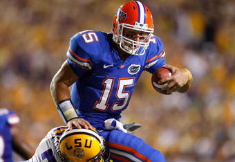 BATON ROUGE, LA - OCTOBER 10:  Patrick Peterson #7 of the Louisiana State University Tigers tackles quarterback Tim Tebow #15 of the Florida Gators at Tiger Stadium on October 10, 2009 in Baton Rouge, Louisiana.  (Photo by Kevin C. Cox/Getty Images)