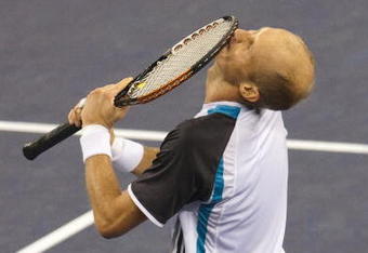 SHANGHAI, CHINA - OCTOBER 18:  Nikolay Davydenko of Russia celebrates match point to Rafael Nadal of Spain during final match on day eight of 2009 Shanghai ATP Masters 1000 at Qi Zhong Tennis Centre on October 18, 2009 in Shanghai China.  (Photo by Victor Fraile/Getty Images)