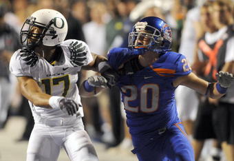 BOISE, ID - SEPTEMBER 3:  Willie Glasper #17 of the Oregon Ducks battles for position with Mitch Burroughs #20 of the Boise State as a pass is thrown in second quarter of the game on September 3, 2009 at Broncos Stadium in Boise, Idaho. Boise State won the game 19-8. (Photo by Steve Dykes/Getty Images)